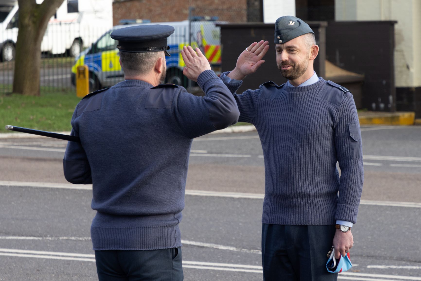 Image show Station Commander saluting RAF aviator.